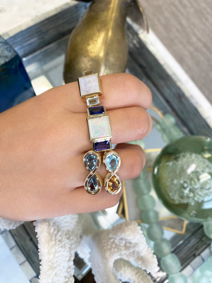 14K YG Ethiopian Opal and Tanzanite Trilogy Ring